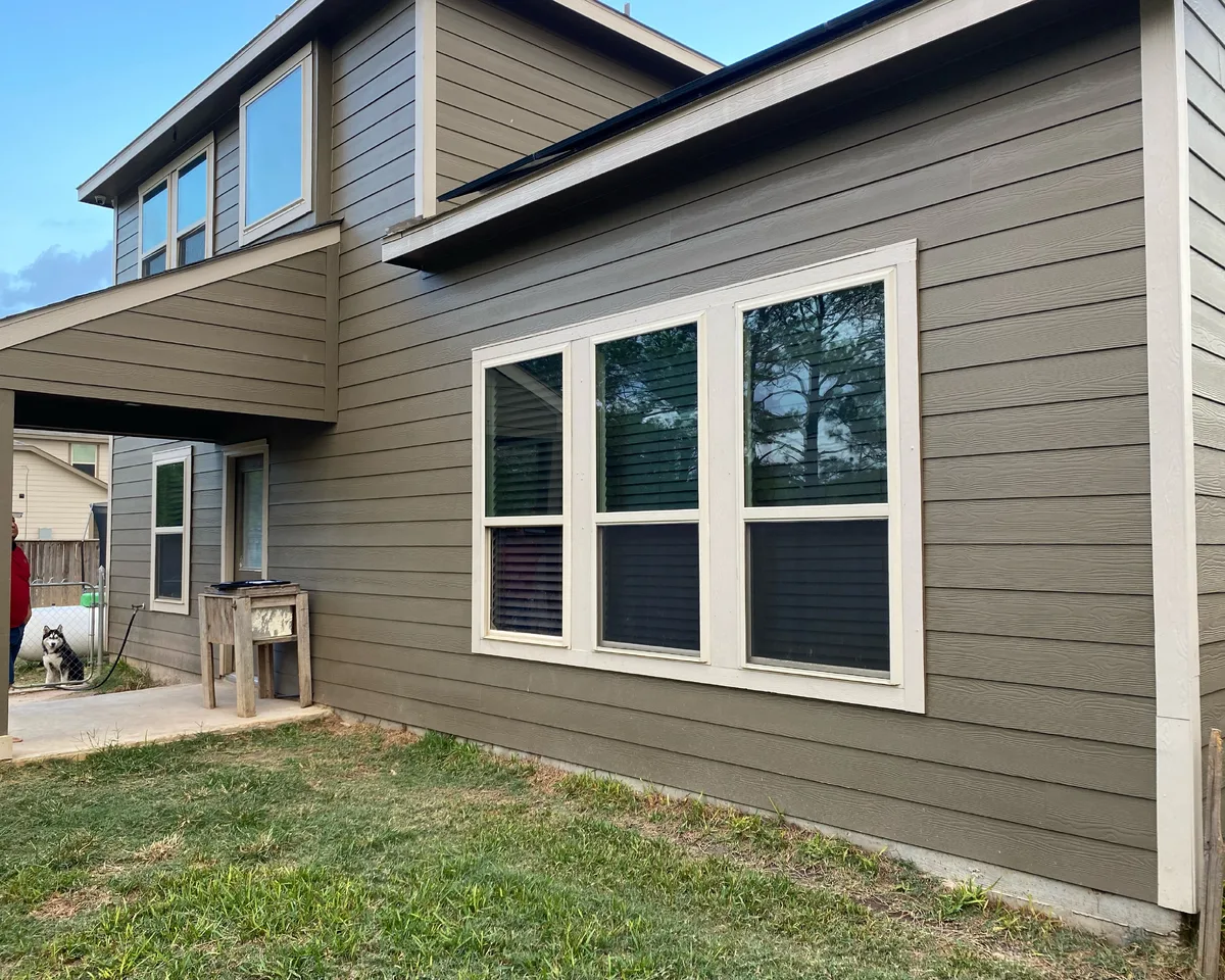 Completed Stilo home exterior with new siding and windows in Houston